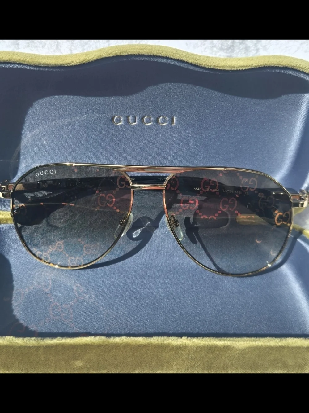 Gucci Gold Aviator Sunglasses with Black Temples and Logo-Pattern Lenses Unisex